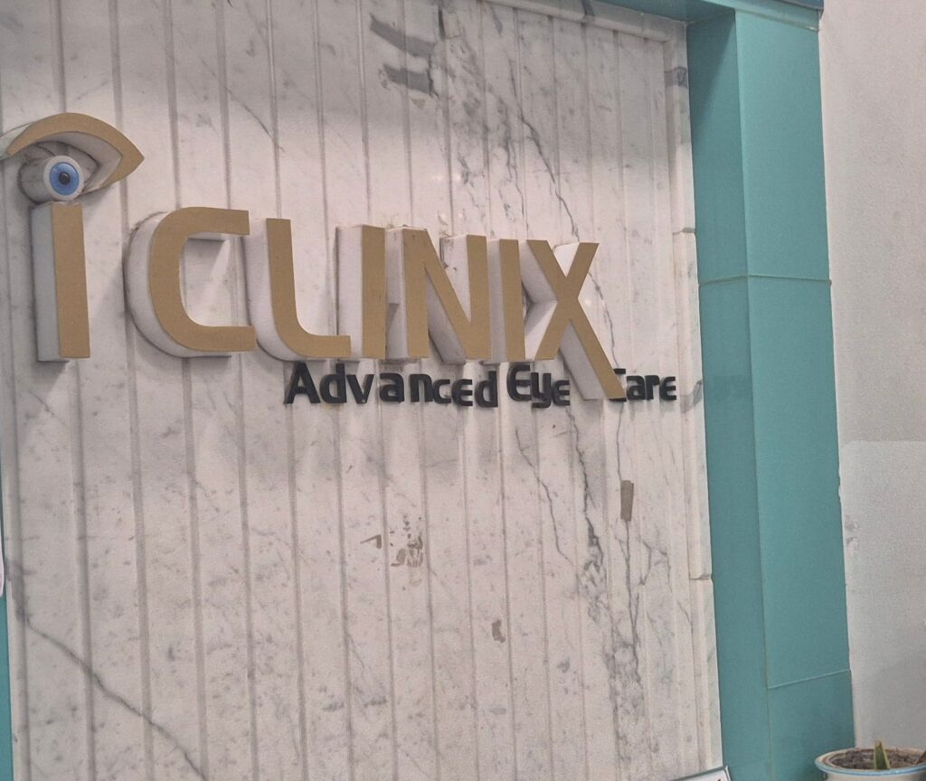 IClinix logo wall at the Lajpat Nagar reception