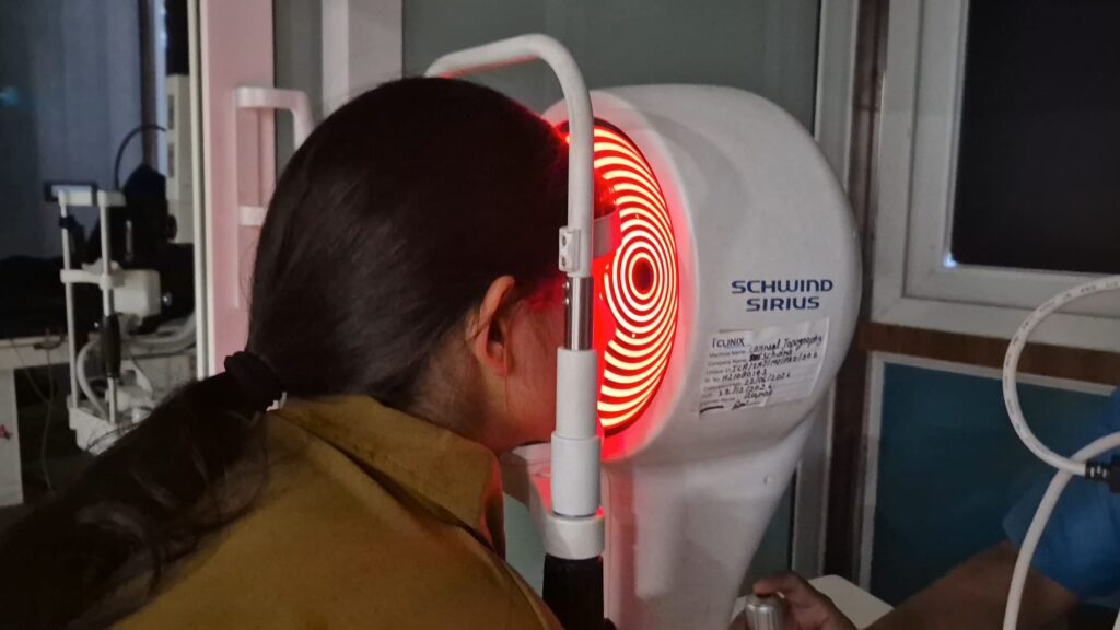 Patient at the Schwind Sirius corneal topographer