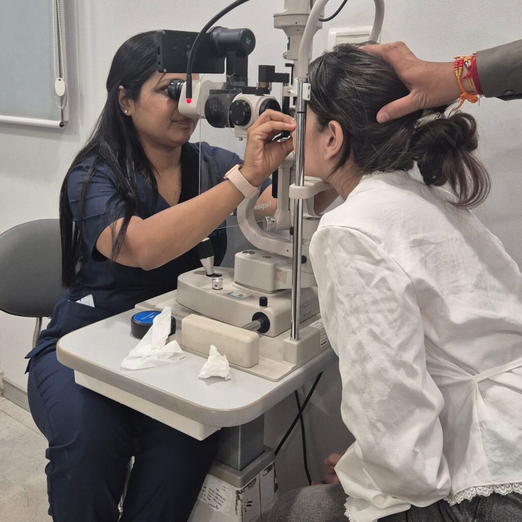 Doctor examining a patient at the slit lamp