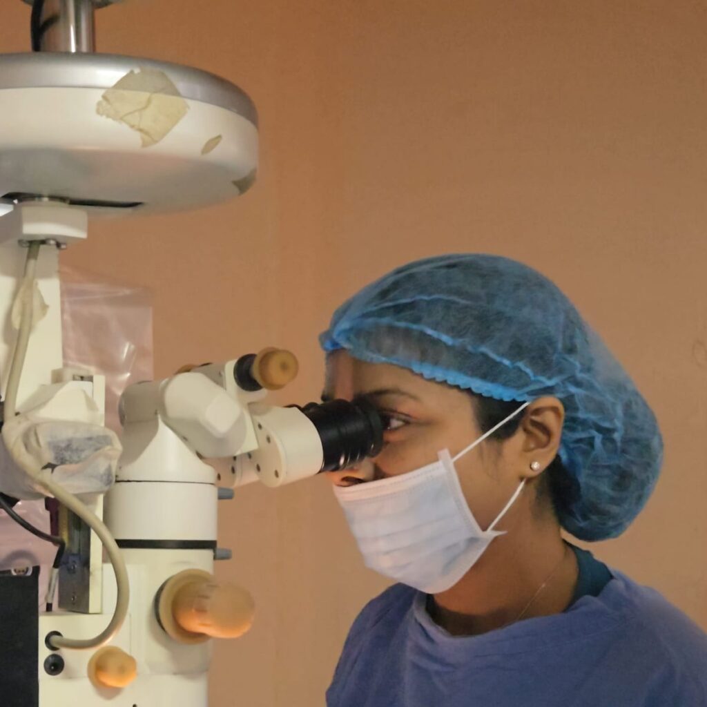 Eye surgeon at the operating microscope