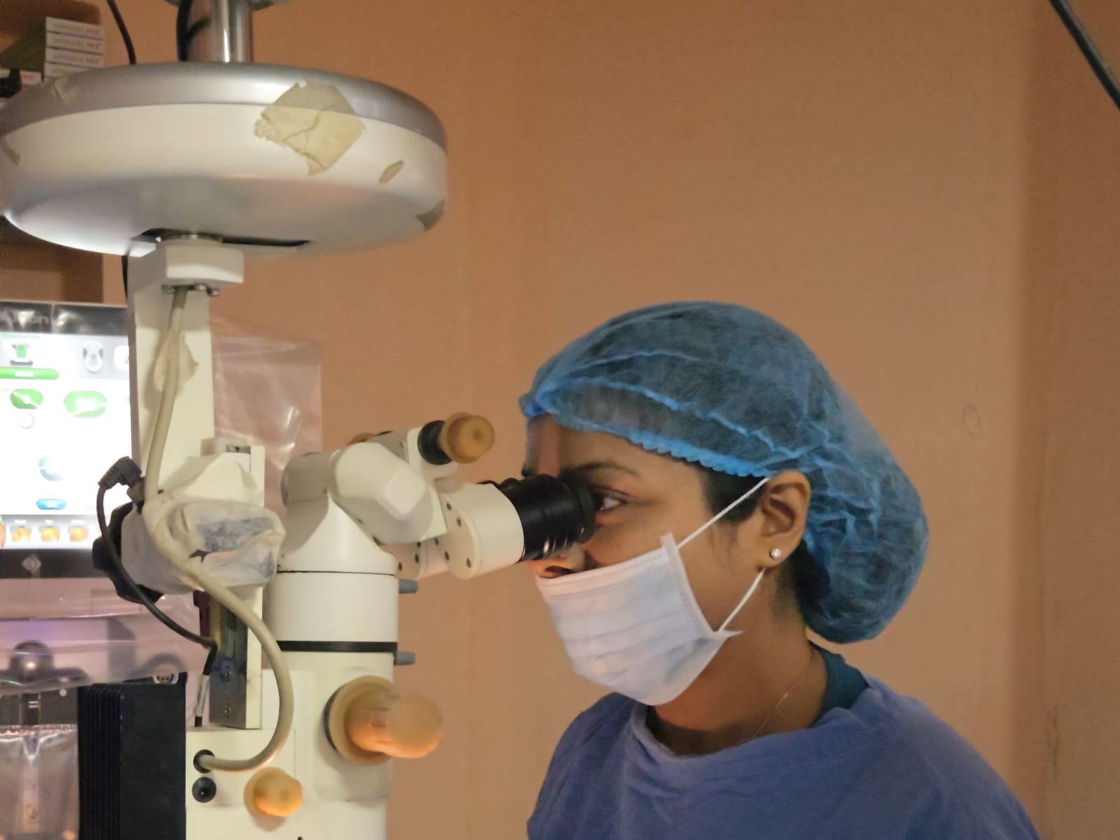 Eye surgeon at the operating microscope