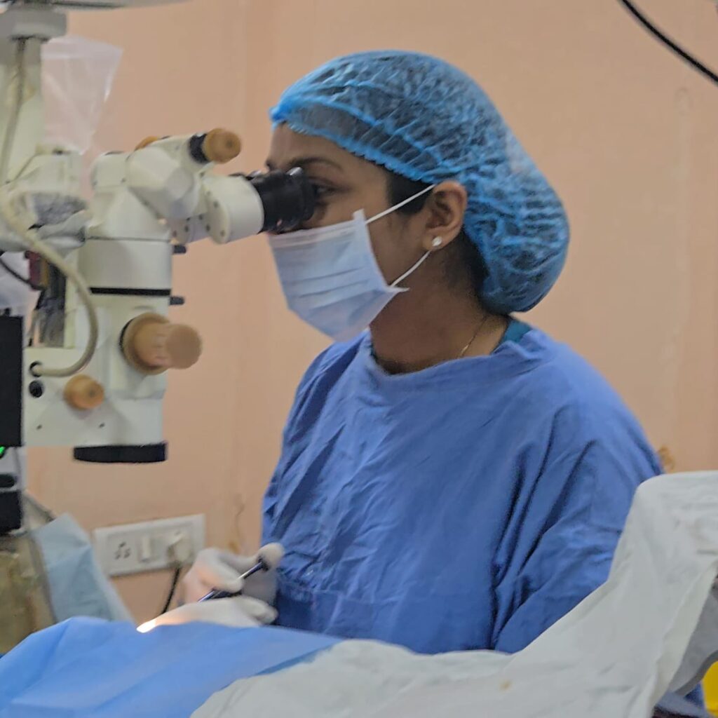 Eye surgeon at the operating microscope