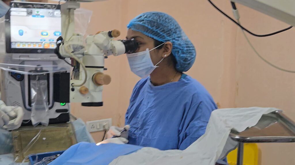 Eye surgeon at the operating microscope